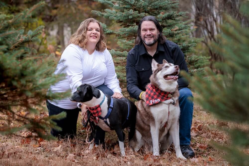 Kevin and his wife with their dogs Poe and Finn